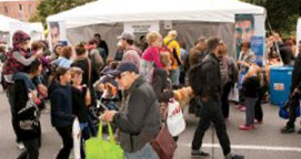A photo of visitors at the College's booth during Toronto's Word On The Street festival.