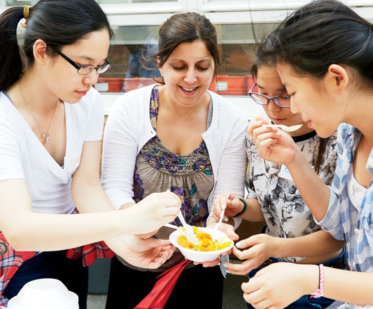 A photo collage of volunteers in action at the annual Picnic for the Arts fundraiser at Huron Street Public School in Toronto.