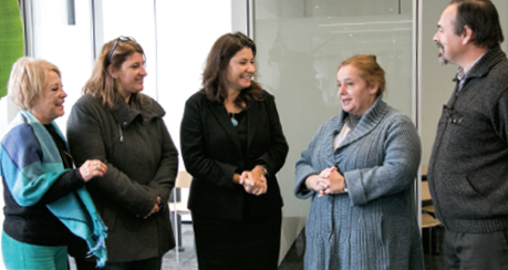 College Council Chair Liz Papadopoulos (centre) speaks with members of the visiting delegation from Uruguay.