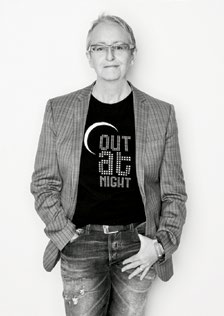 A profile photo of Helen Kennedy wearing a shirt that says, 'Out At Night.'