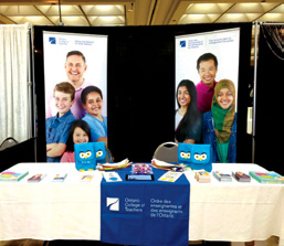 Photo of a College booth during the The Mama Expo & Fam Jam in Windsor. The booth is decorated with various College literature.