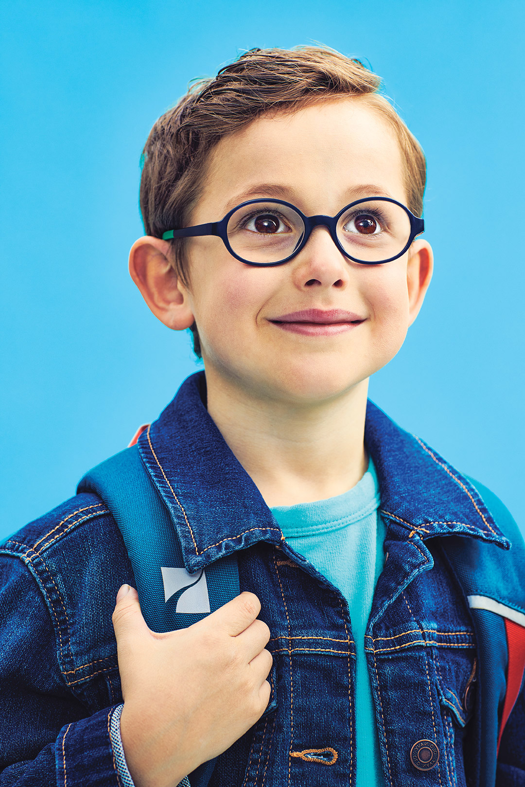 Photo of a young student smiling.