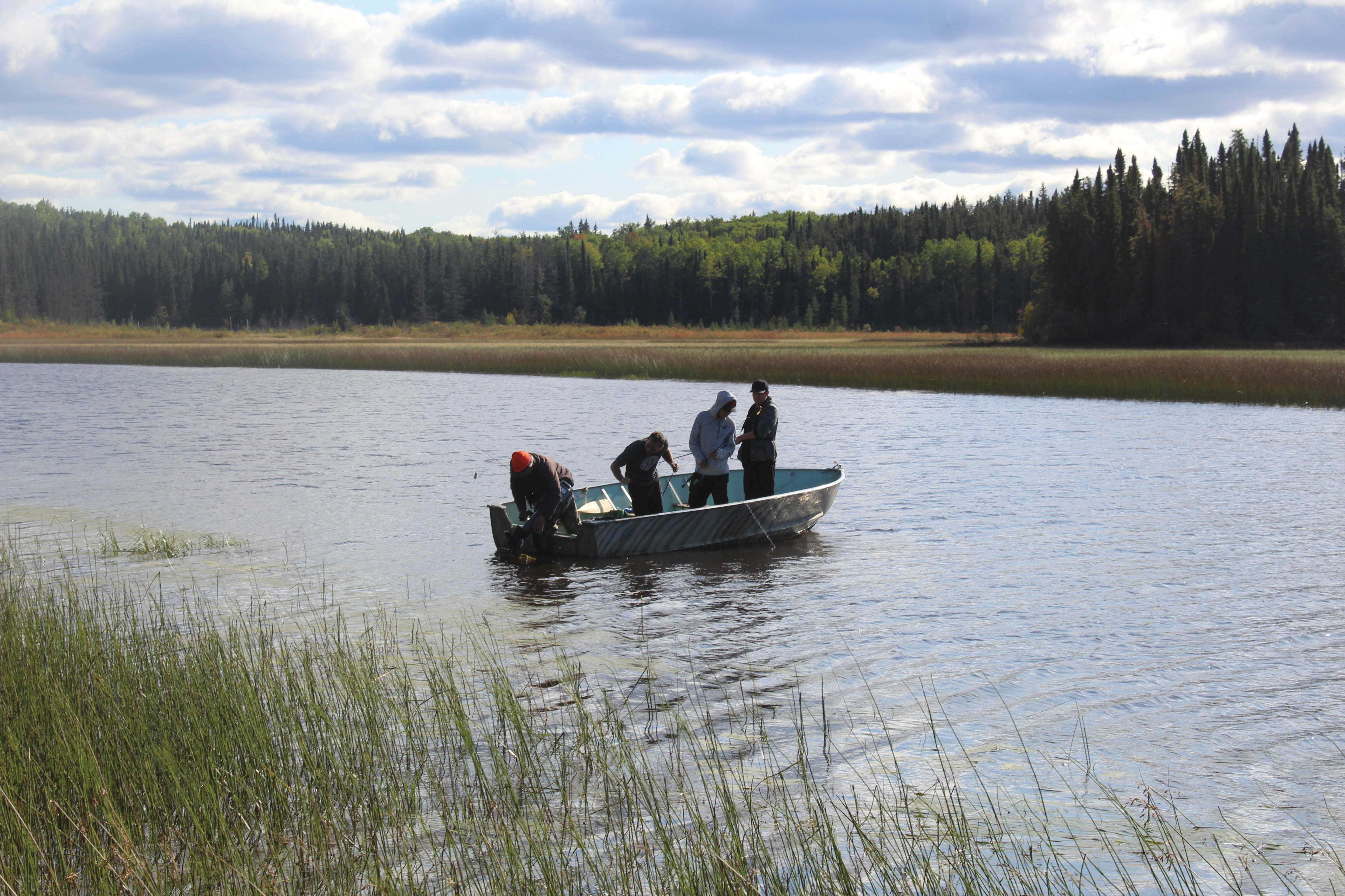 Keewaywin students learning how to fish on a field trip