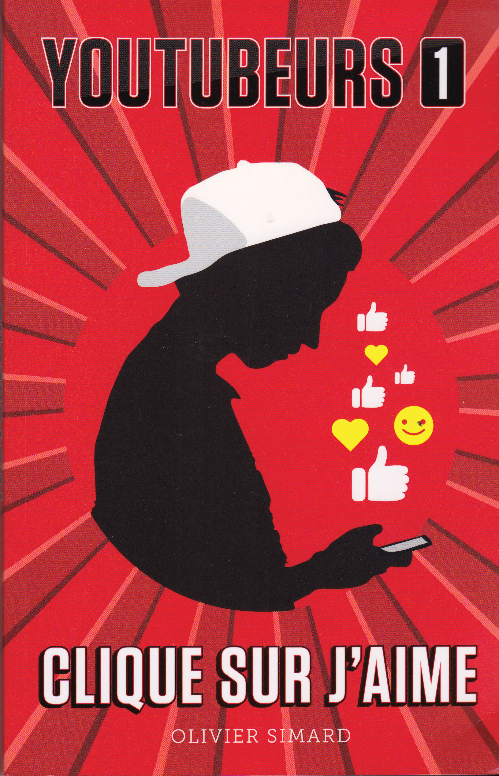Image de la couverture du livre «YouTubeurs 1, clique sur j'aime». Sur la couverture se trouve la silhouette d'un garçon portant une casquette et regardant son téléphone cellulaire, sur fond rouge. Des émojis de coeurs, de pouces levés et d'un visage souriant sont devant lui.