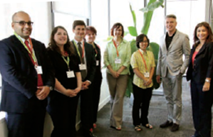 A photo of former chair of Council Liz Papadopoulos and College CEO and Registrar Michael Salvatori standing with representatives from the U.K. Professional Standards Authority.