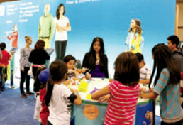 A photo of College staff with a group of children at the Pinoy Fiesta in Toronto.