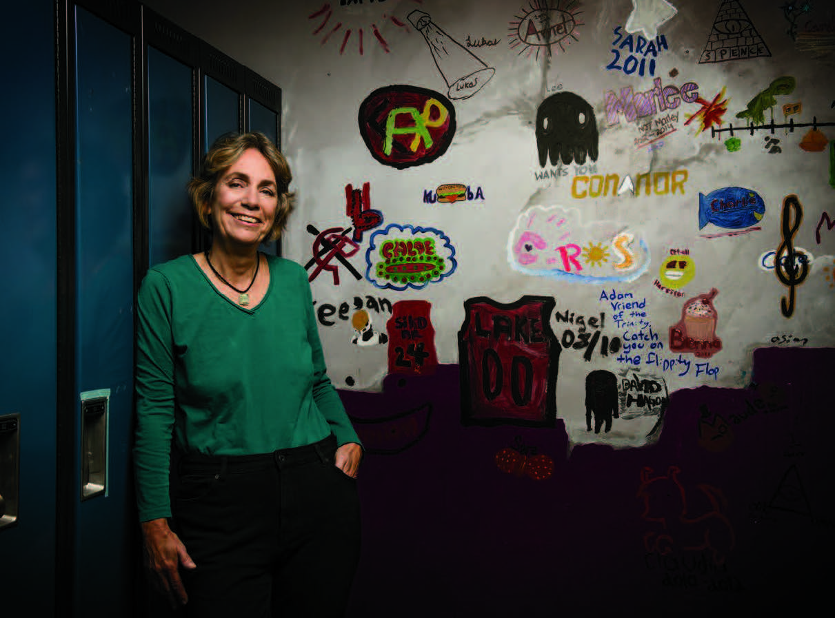 Photo of Lynn Heath, Ontario Certified Teacher, leaning on a locker.