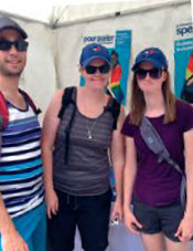 A smiling group of people at the Toronto Pride festival.