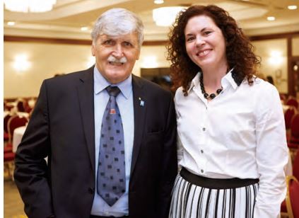 Photo of College Chair Angela De Palma smiling with COllege keynote Romeo Dallaire.