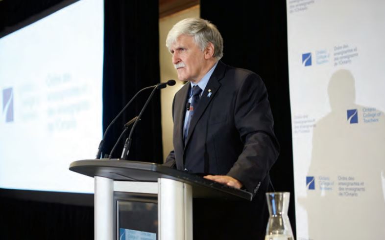 A photo of retired Canadian Army Lieutenant-General Roméo Dallaire. Roméo is speaking at a podium during the College's 'Inspiring Public Confidence' conference.