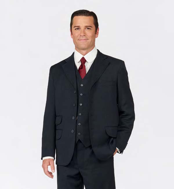 Yannick Bisson stands with hand in pocket. Yannick is wearing the costume from television show, "Murdoch Mysteries."