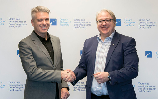 Photo of College CEO and Registrar Michael Salvatori, Ontario Certified teacher, shaking hands with
French Language Services Commissioner François Boileau