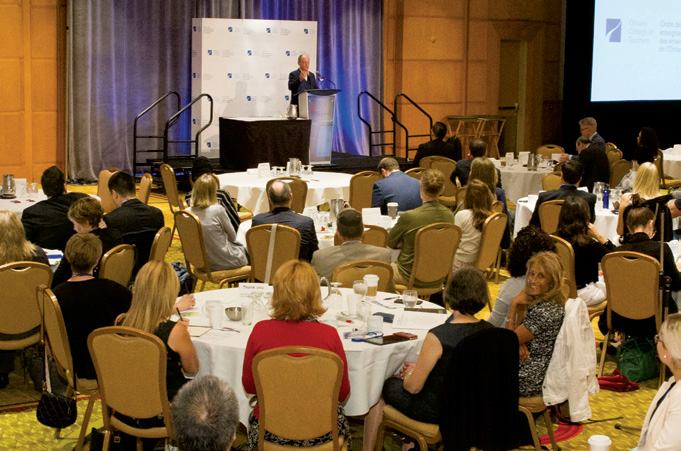 A photo of keynote speaker Rex Murphy addressing an audience at the College's 'Inspiring Public Confidence' Conference 2018.