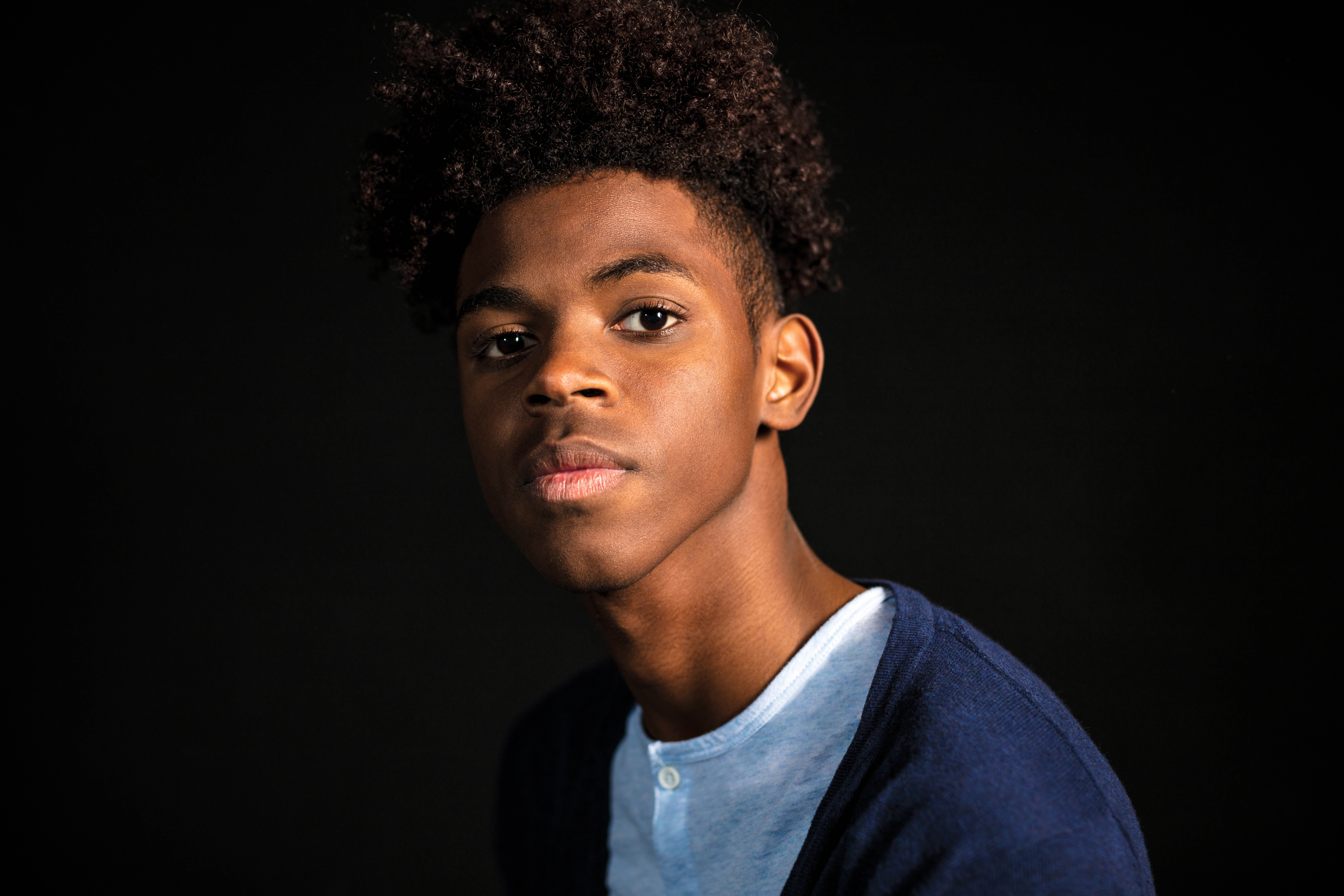 A young student looking directly at the camera.