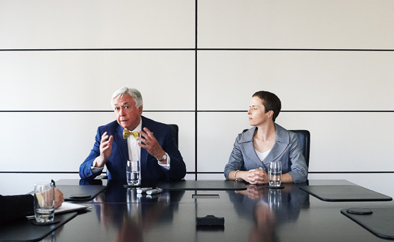 Patrick LeSage and K. Lynn Mahoney at conference table